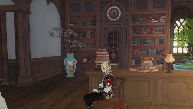 Kaveh sitting on a chair in a Howl's Moving Castle replica. 