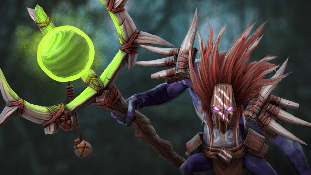 Witch Doctor, a purple creature wearing a red mask with feathers, holds a wooden staff with a green orb and points it ahead of him.