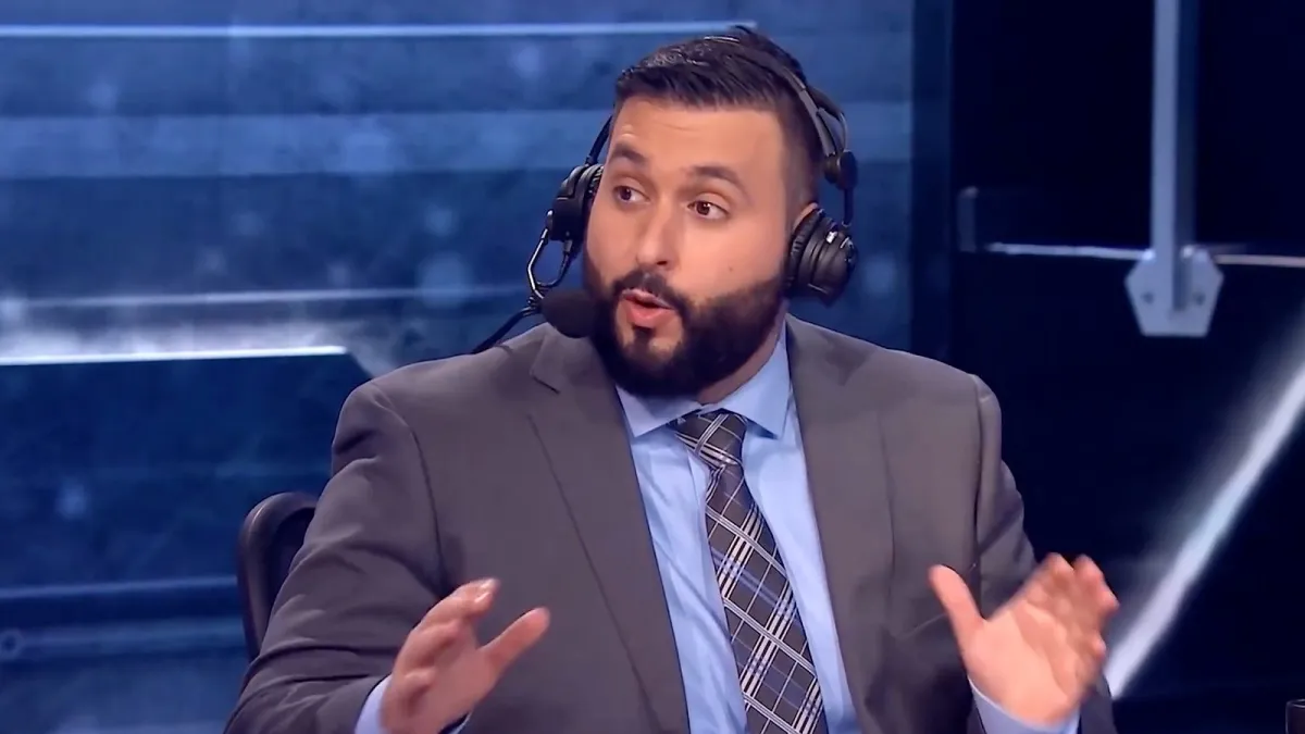 Famous CS:GO male streamer m0E during his stint as an analyst for ELEAGUE. He has short black hair and a grown beard.