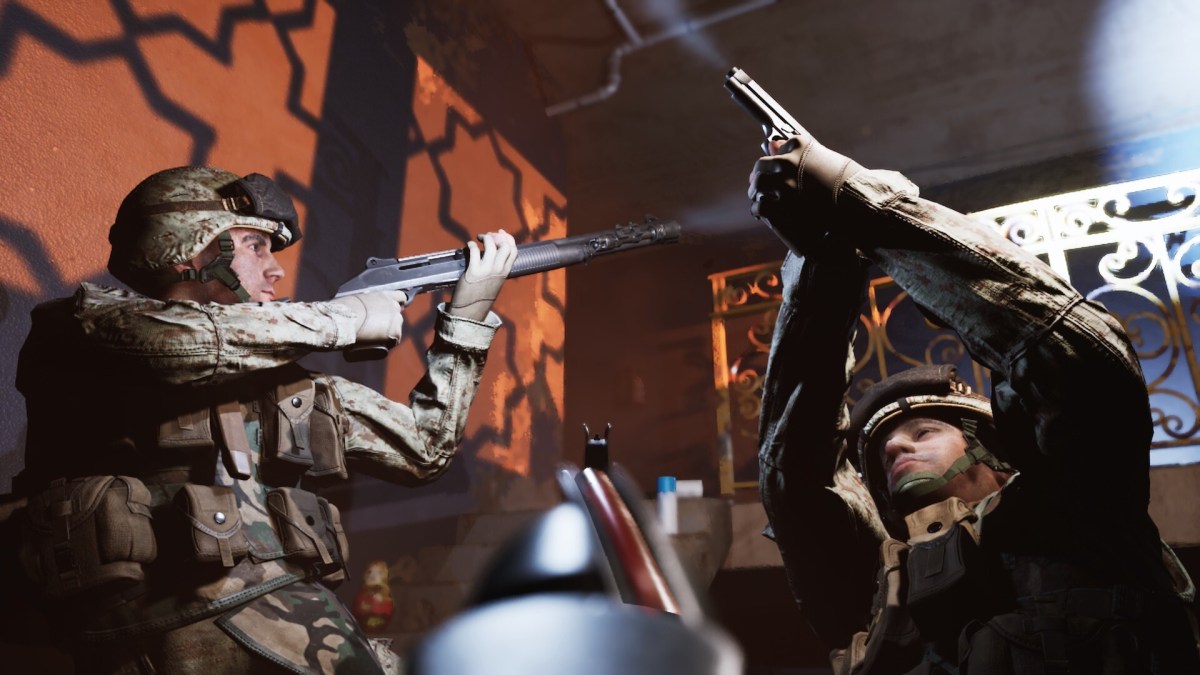 one soldier is lookign through his iron sights as two others stand with their rifles pointed in opposite corners of the screen as they clear a building