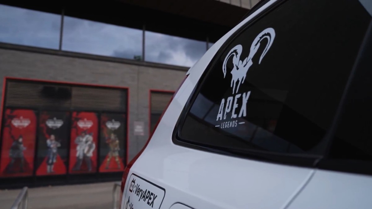 A white car with the Apex Legends logo, driven by Vita, outside of the ALGS venue in London.