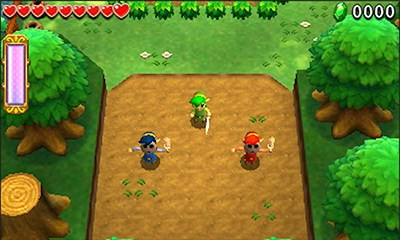 Three Links colored green, blue, and red appear in Zelda Triforce Heroes co-op gameplay.