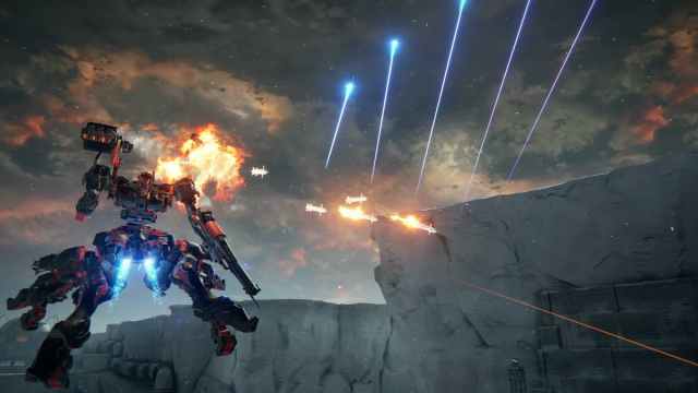 A tetrapod armored core flying and firing both standard and plasma missiles
