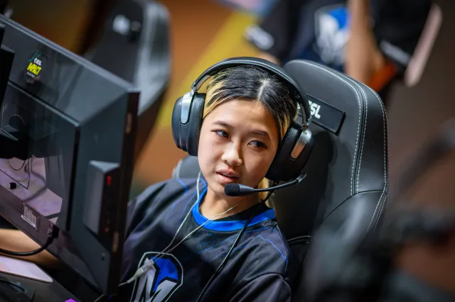 BiBiAhn sits at her computer at IEM Dallas in her Mindfreak jersey, playing CS:GO.