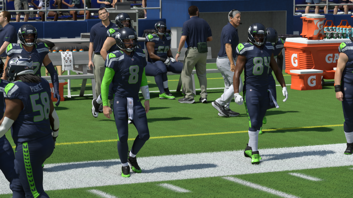 Offensive players in Madden 24 take to the field in Ultimate Team, wearing the Seattle Seahawks uniforms.
