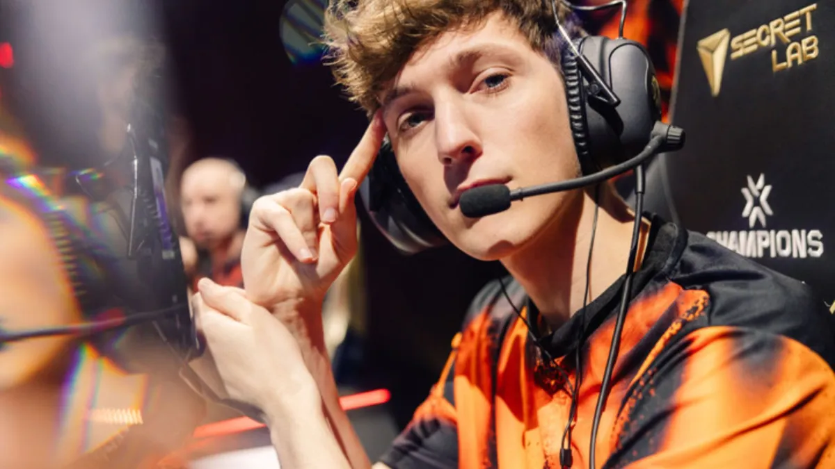 Photo of Fnatic IGL Boaster at VCT Champions 2023 looking into the camera and holding his right index finger against his forehead