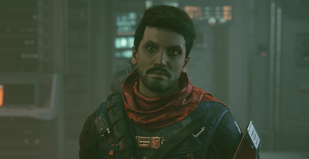 Delgado staring down camera in Starfield, a brown-haired man with a beard and a red scarf.