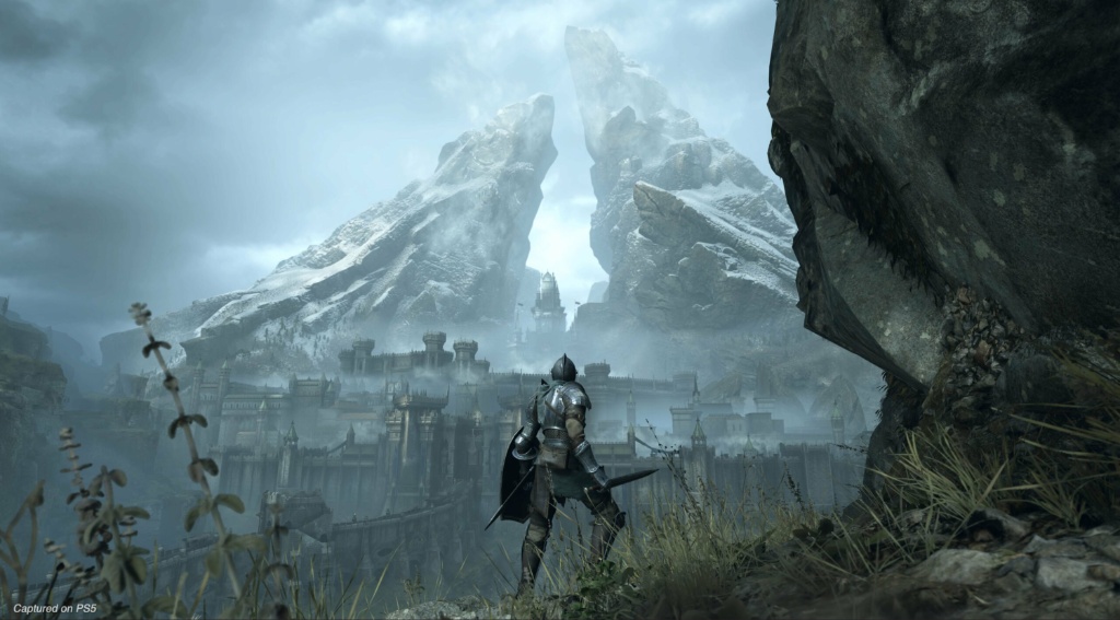 The Slayer of Demons seen with a mountain underpass and castle in the foreground ahead of him