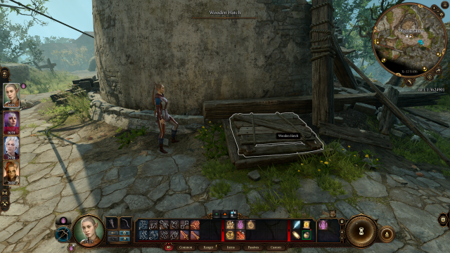 A screenshot from Baldur's Gate 3 showing the player character standing by a wooden hatch near the windmill.