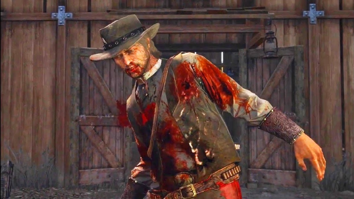 An image of John Marston dying to gunfire with a barn in the background in Red Dead Redemption.