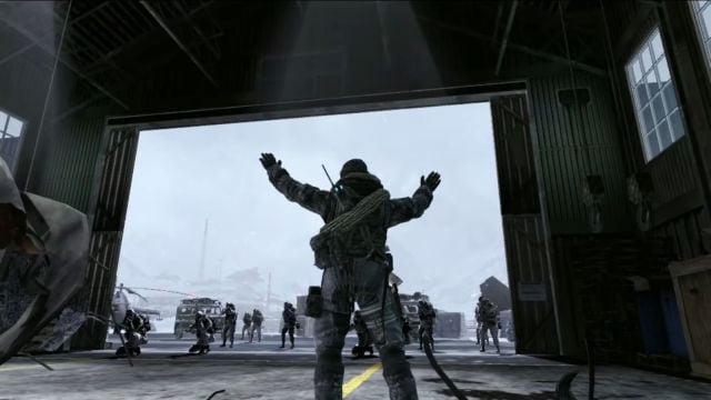 Image showcasing soldier standing in a hanger with enemies surrounding the character. There are grey skies in the background.