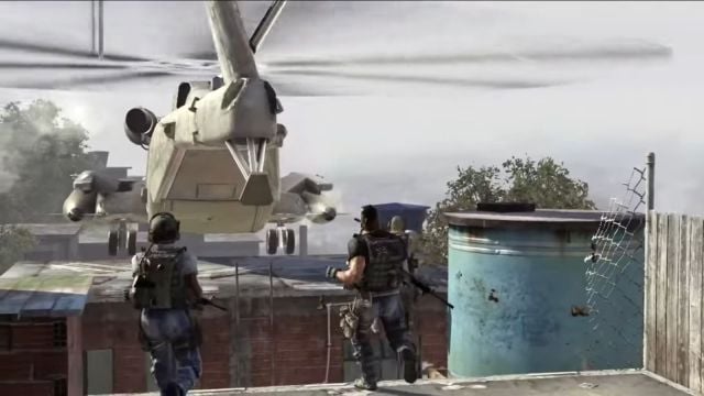 Image showcasing a helicopter scene from the campaign of Modern Warfare 2. There are two soldiers making their way to the side of a building where the helicopter is mid-air.