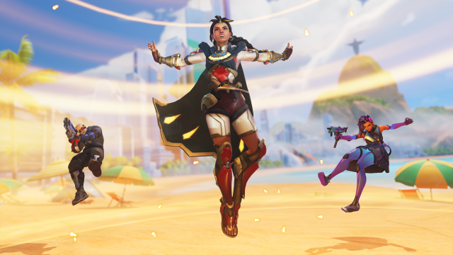 Illari using her Outburst ability on the beach, knocking back an enemy Sombra and Soldier: 76.