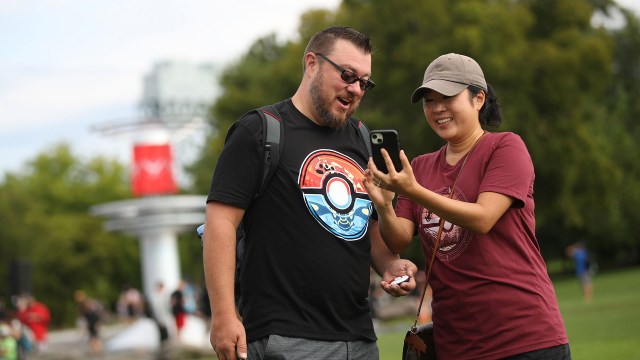 Two players enjoying Pokemon Go Fest.