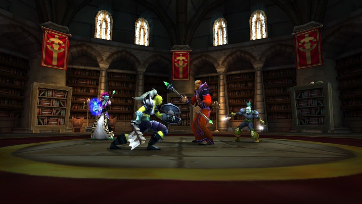 A group of WoW Classic characters face off in battle in the Scarlet Monastery Library