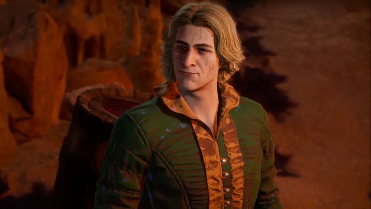 Man with blond hair in green outfit in a cave in BG3