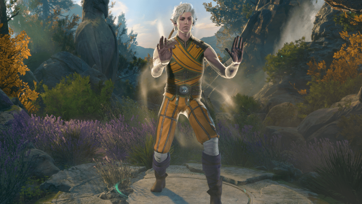 In the BG3 class editor, the pale skinned elf Astarion stands with palms out in BG3's yellow and green monk gi. He does a forward-leaning pose with a natural background.