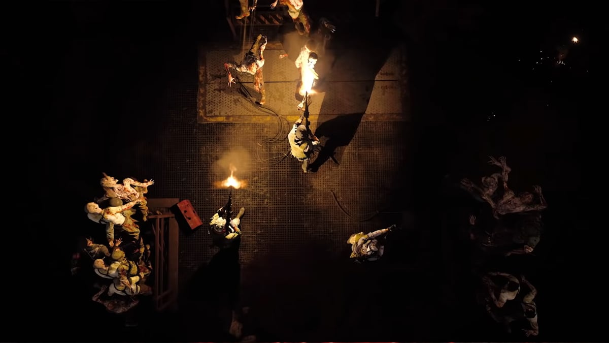 An overhead shot of a bunch of zombies rushing through the darkness to attack players in Call of Duty: Black Ops Cold War.