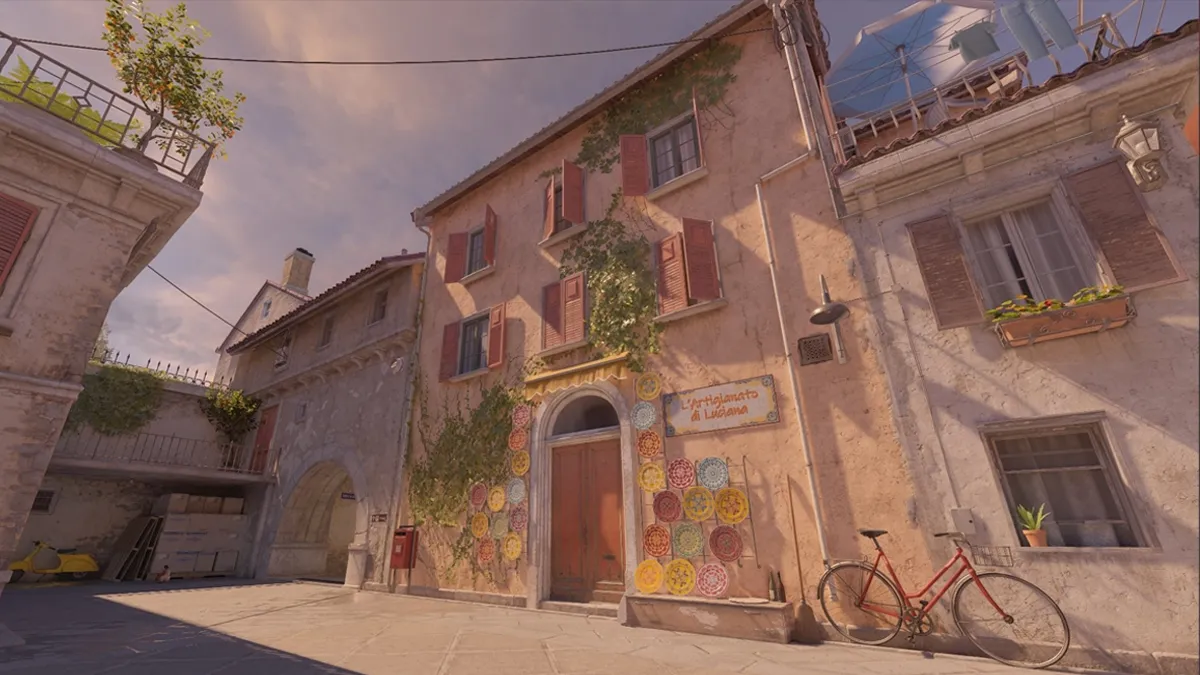 The sun sets outside an Italian-styled cobblestone pathway and building on Italy in Counter-Strike 2.