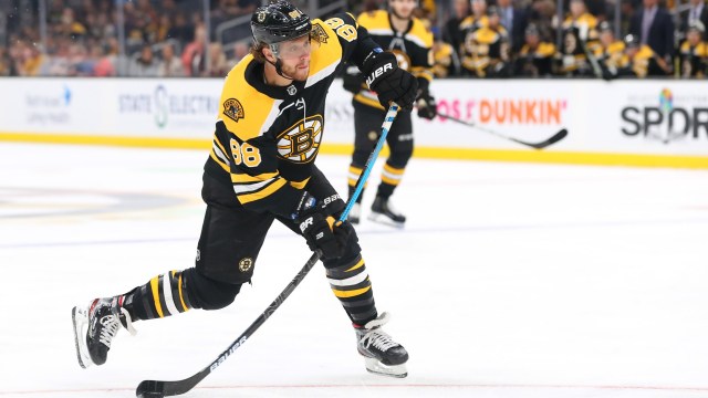 David Pastrnak number 88 with the Boston Bruins is taking a slapshot, looking to score.