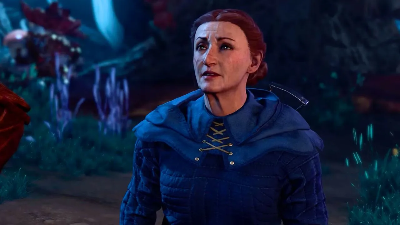 Woman wearing a blue cloak with her hair tied up and a sour expression in Bg3