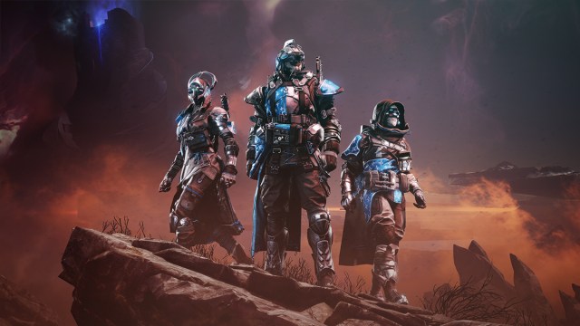 Three guardians stand shoulder-to-shoulder in new armor on a rocky hill in Destiny 2.