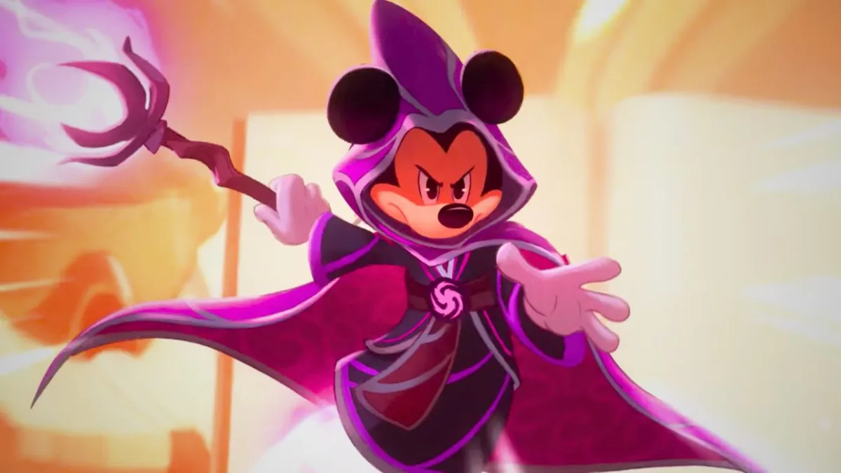 A mouse wearing a purple cape and wielding a glowing staff in Disney Lorcana