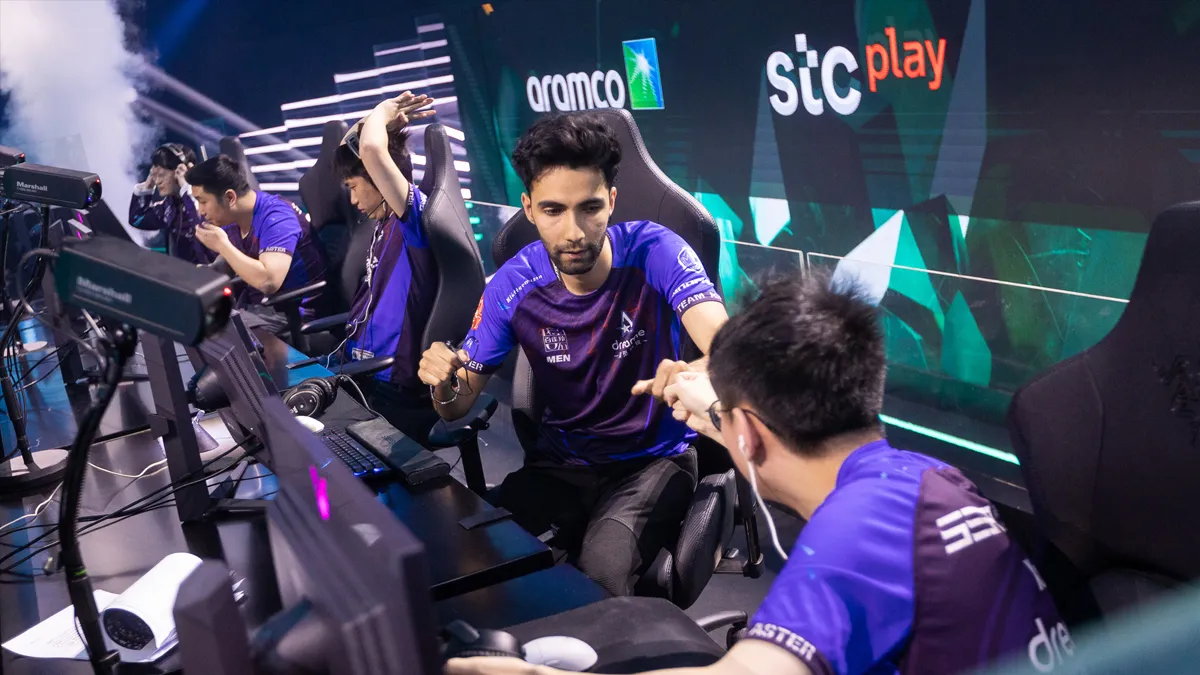 SumaiL, a pro Dota player, celebrates on-stage at the Riyadh Masters after winning a game with Team Aster.