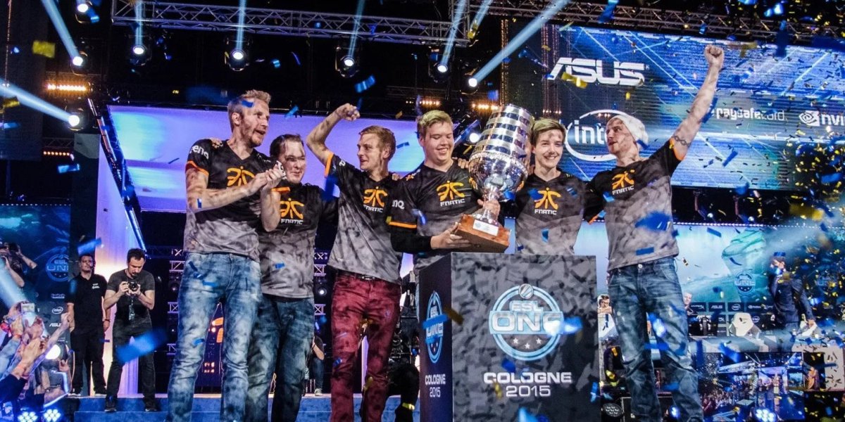 JW of fnatic holding the ESL One Cologne 2015 trophy on stage