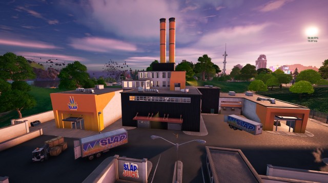Slap Factory, a predominantly black building with orange and white paint, and two orange chimneys coming out of the top. 
