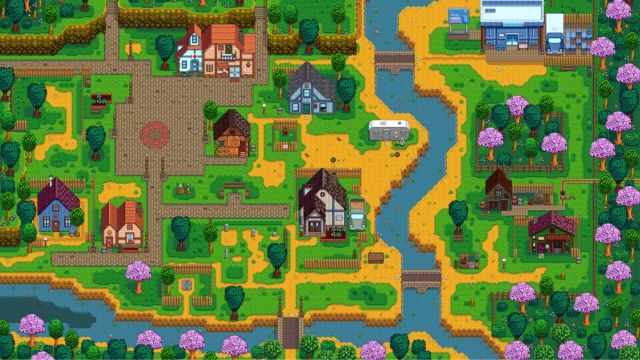 A river surrounded by trees and houses in Pelican Town in Stardew Valley