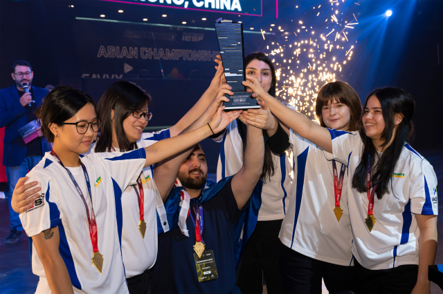 The Australian team celebrates their victory at the IESF Female Asian Championships in Riyadh, Saudi Arabia.