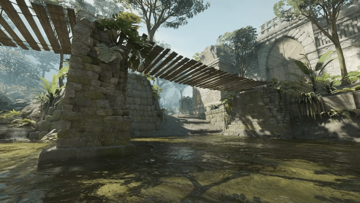 The T spawn of Ancient: a jungle of greenery with a stone column and an old wooden plank bridge with a stream of water running beneath it.