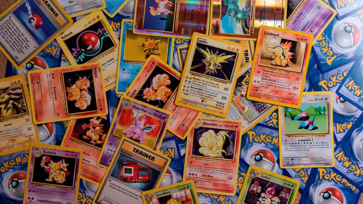 A selection of Pokemon cards spread out.