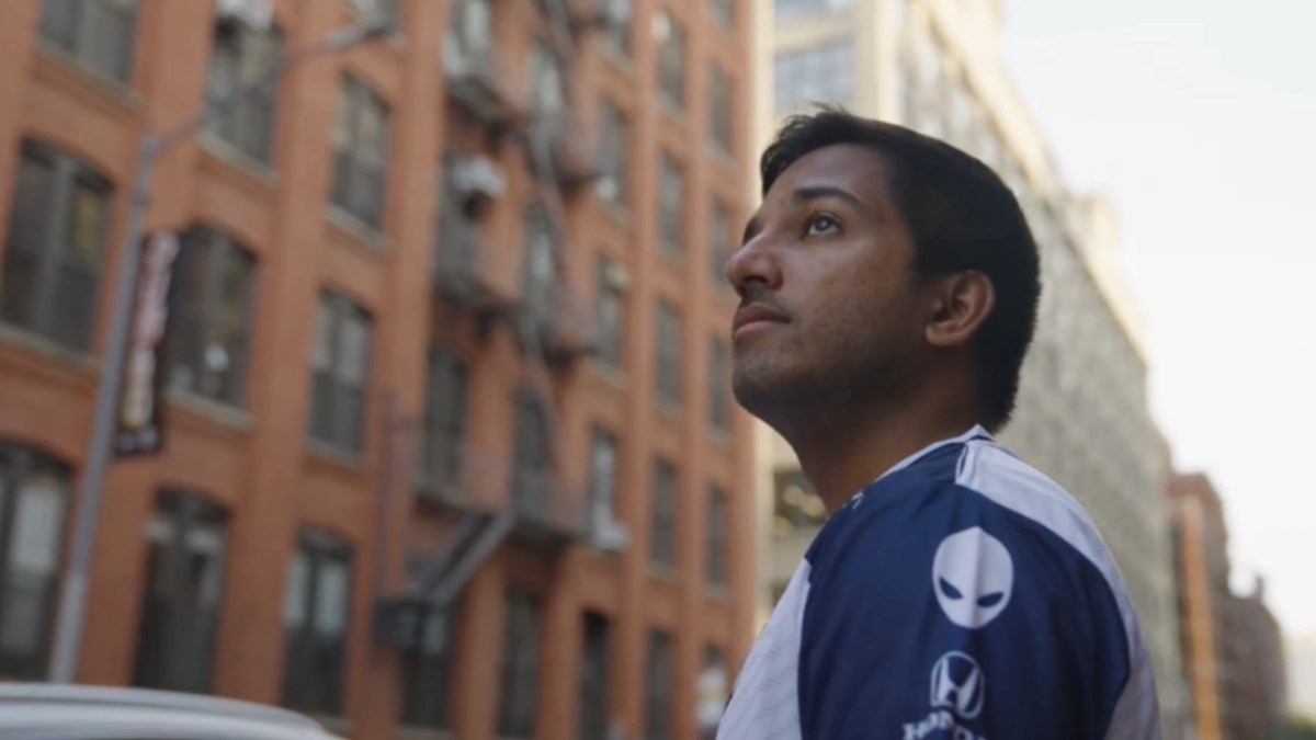 rereplay, TFT player for Team Liquid, staring into the distance in a city.