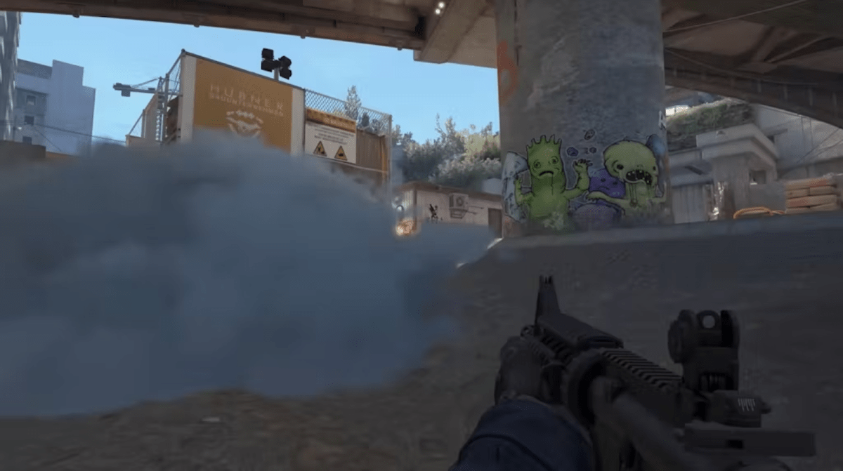 Smoke at Monster on Overpass in CS2 with an M4A4 in the players hand