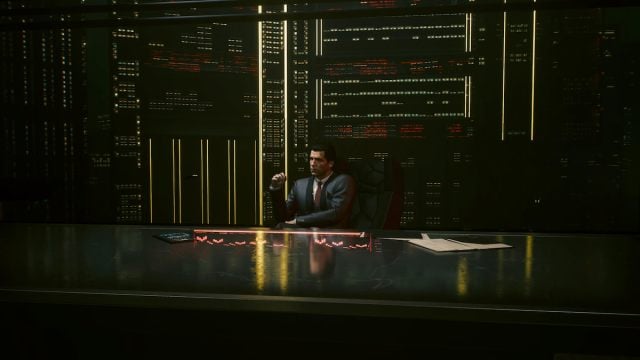 A character in a suit sits in front of a giant screen pondering in Cyberpunk 2077.