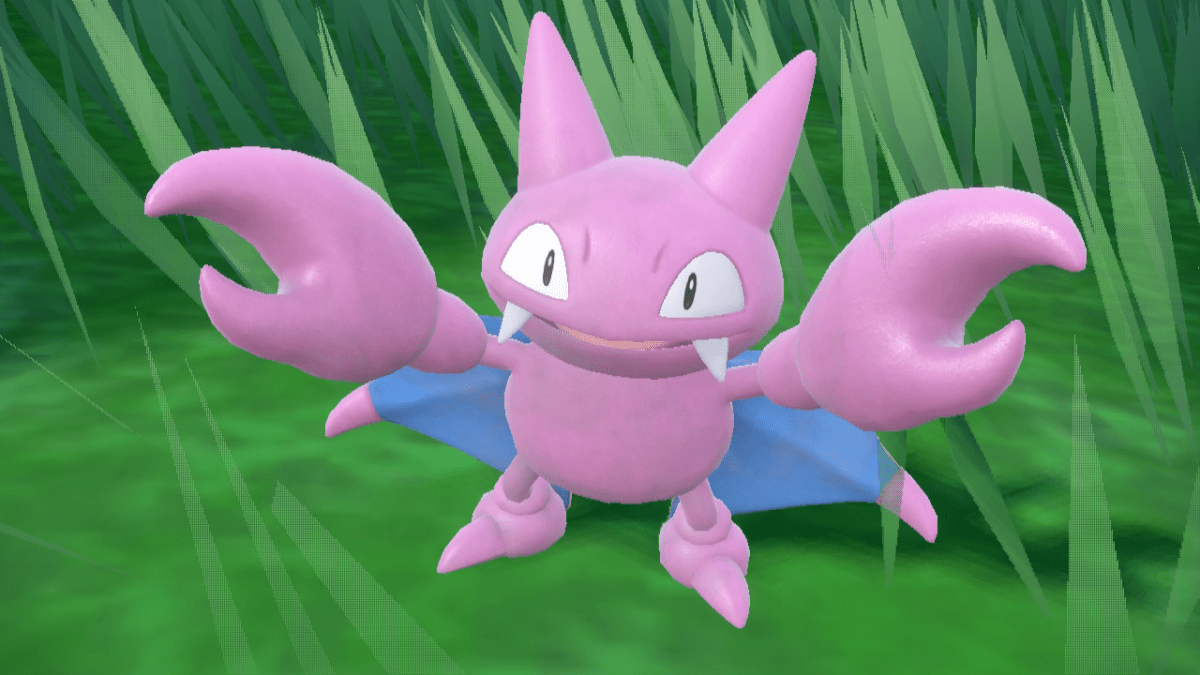 Gligar, a purple bat-like creature with two pincers and blue wings, stands against a grassy background in Pokémon Scarlet and Violet's The Teal Mask DLC.