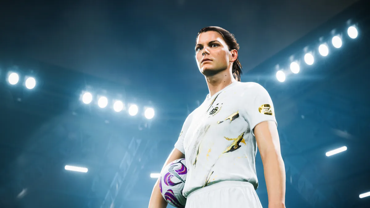 Mia Hamm in EA FC 24 wearing the Icon kit and holding a ball beneath floodlights.