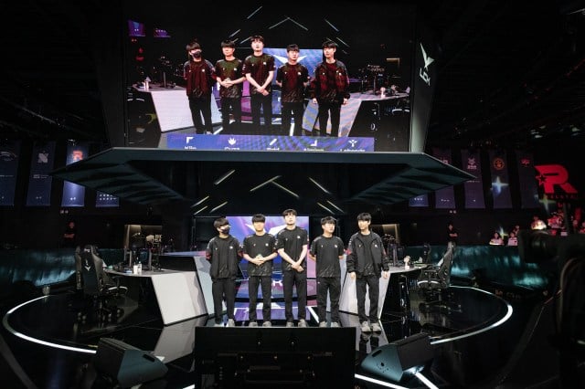 Bdd stands with his team on-stage.