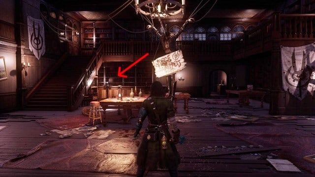 An arrow pointing to a chest behind the counter in the Malum District Town Hall