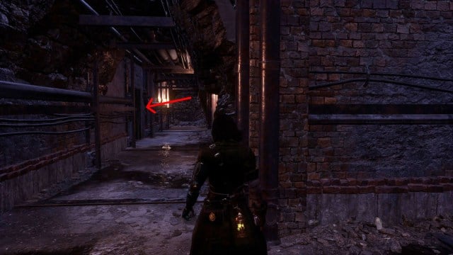 A dark tunnel with a Trinity Door on the left-hand side in Lies of P.