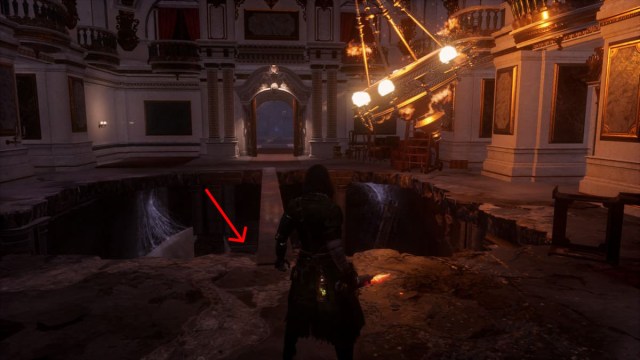 A narrow beam with a swinging chandelier in Lies of P. At the bottom of the pit is a Trinity Door.