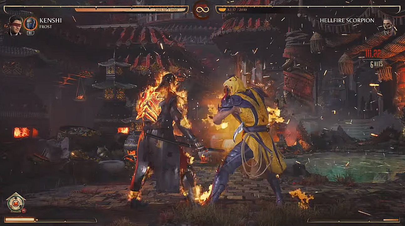 There are two fighters battling each other. They are both covered in fire, and there is a temple behind them in the background.