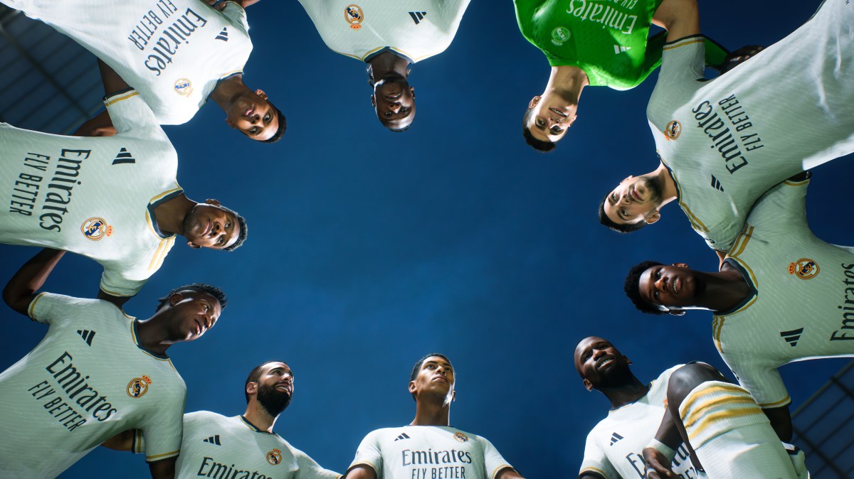 Real Madrid players in EA FC 24 in a huddle on the field.