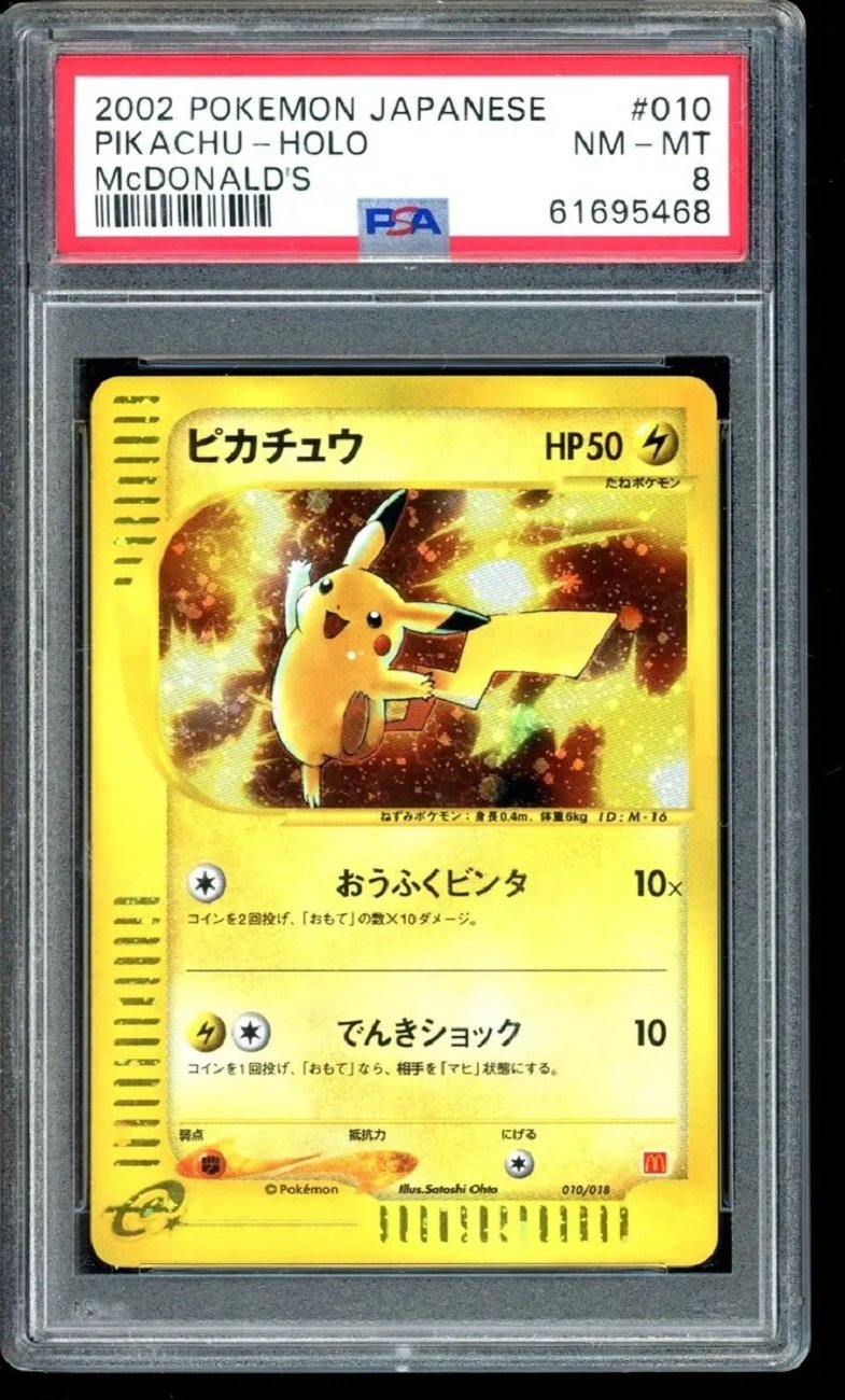 There is a Pikachu card in a case. The Pikachu has lightning bolts around it, and the card is holographic.