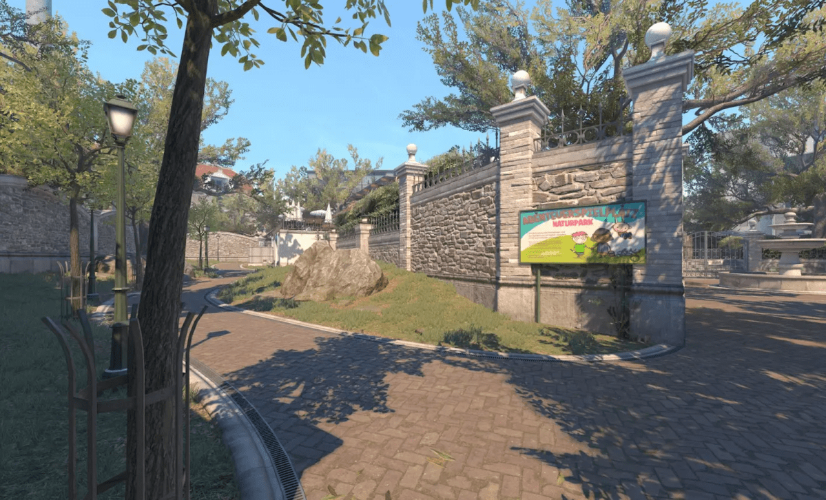 Overpass CS2 Long entrance from T spawn with trees and grass surrounding the wall to party.