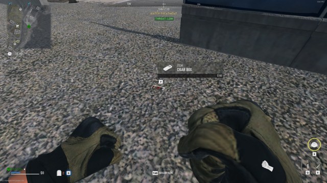 A player holds their fists up while looking at the pavement, with a box of cigars sitting there in DMZ.