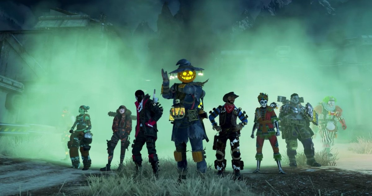 Lifeline, Wattson, Crypto, Bloodhound, Mirage, Bangalore, Gibraltar, and Caustic all stand together in Halloween outfits.