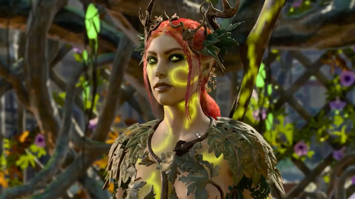 Woman with green markings, clothing, and vines in her hair in BG3